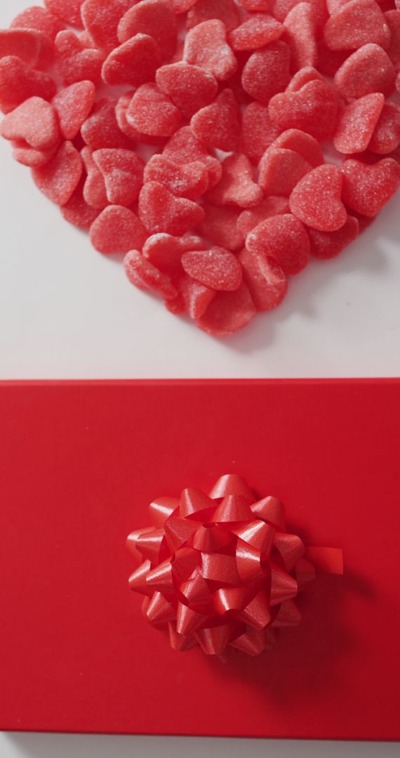Heart-Shaped Candies and Red Gift Box Top View