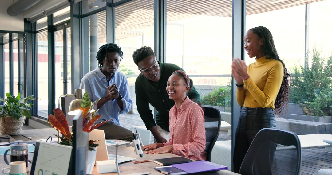 Diverse Team Successfully Collaborating in Modern Office Setting
