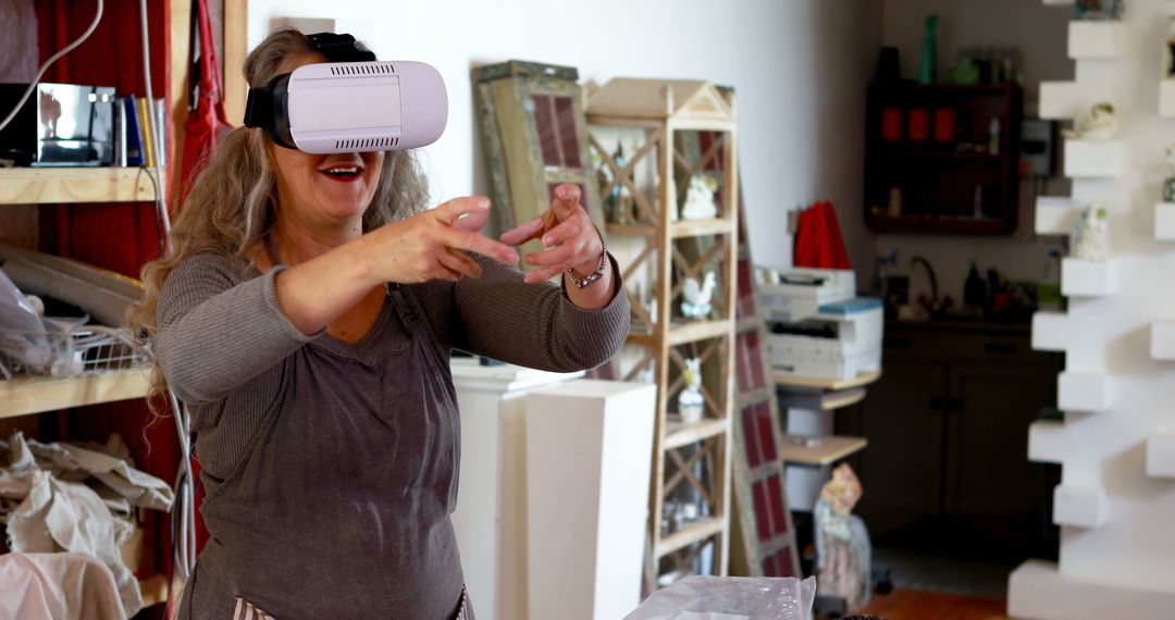 Woman Using Virtual Reality Headset in Craft Room Creating Art - Free Images, Stock Photos and Pictures on Pikwizard.com