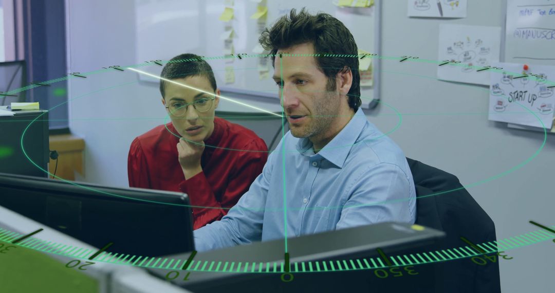 Innovative Team Collaboration Analyzing Data on Office Monitors