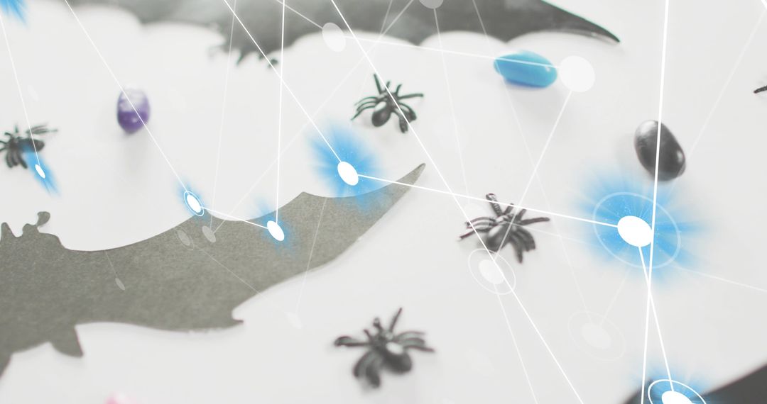 Spooky Halloween craft scene showing bat silhouette, toy spiders, candy and tech network overlay