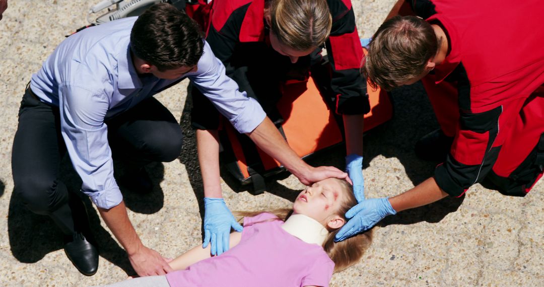 Paramedics and Bystander Providing Emergency Treatment to Injured Child - Free Images, Stock Photos and Pictures on Pikwizard.com