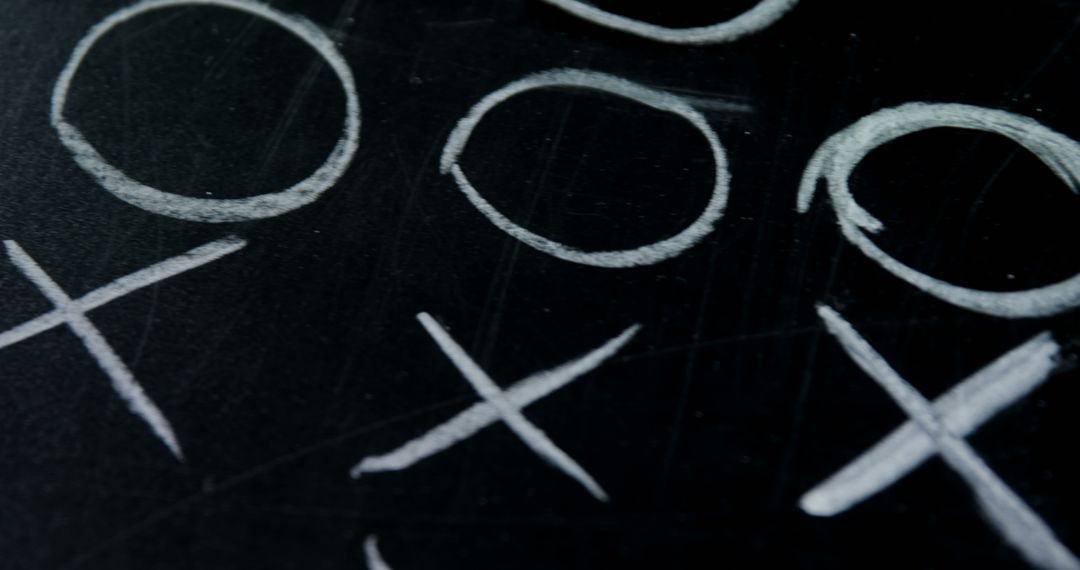 Tic Tac Toe Game on Black Chalkboard - Free Images, Stock Photos and Pictures on Pikwizard.com