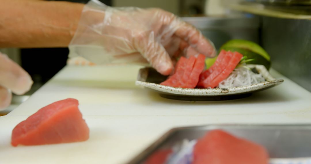 Chef Preparing Fresh Sashimi Tuna in Professional Kitchen - Free Images, Stock Photos and Pictures on Pikwizard.com