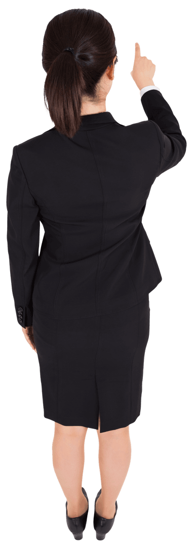 Transparent Back View of Businesswoman Pointing Upward Indoors