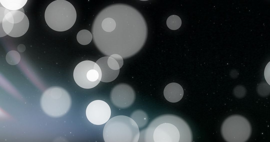 Glowing Bokeh Light Spots on Black Background
