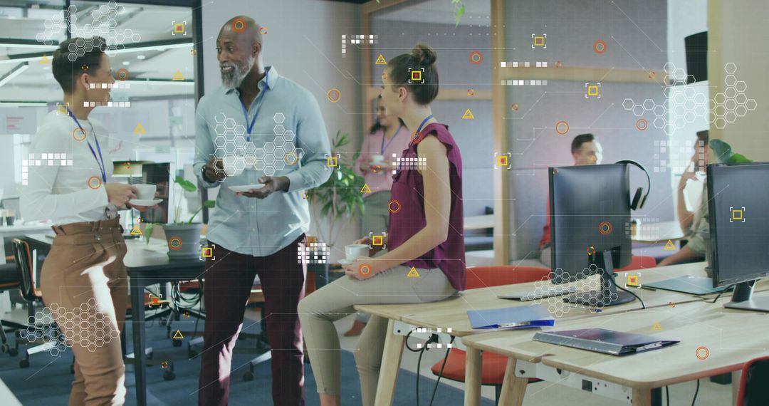 Coworkers Collaborating in Modern Open-Plan Office with Digital Graphics