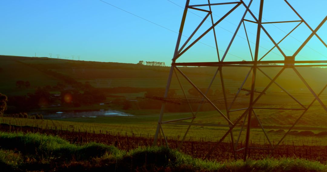 Electricity Pylon in Scenic Countryside During Sunset - Free Images, Stock Photos and Pictures on Pikwizard.com