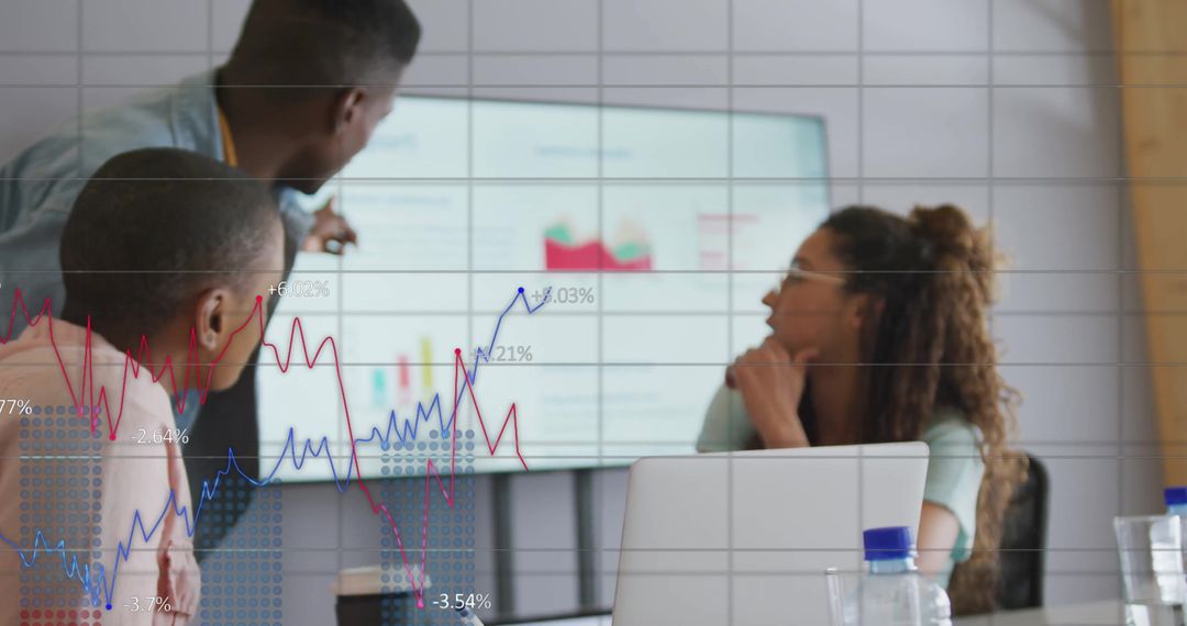 Team Analyzing Financial Data in Modern Office with Graph Overlay