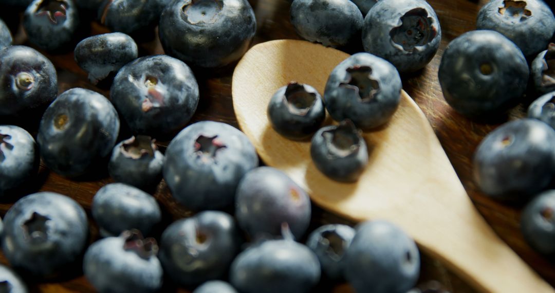 Close-up of fresh blueberries on wooden table 4k - Free Images, Stock Photos and Pictures on Pikwizard.com