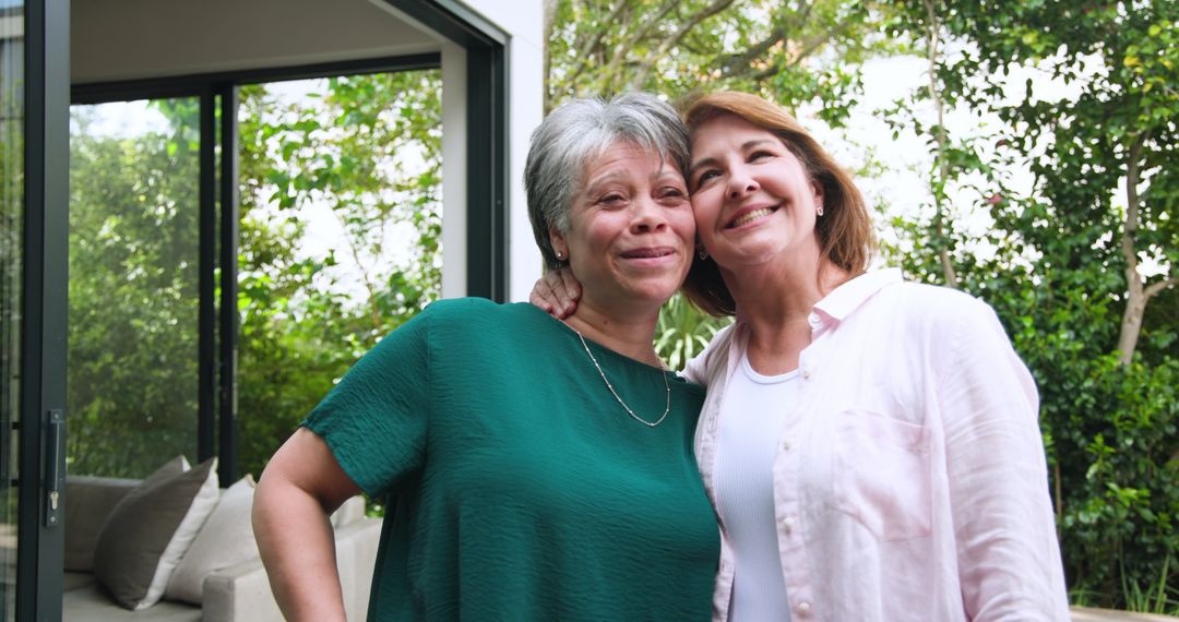 Diverse Mother and Daughter Embracing on Modern Patio