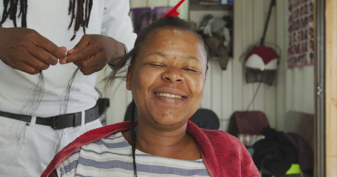 Smiling Woman Getting Braided Hairstyle at Salon - Free Images, Stock Photos and Pictures on Pikwizard.com