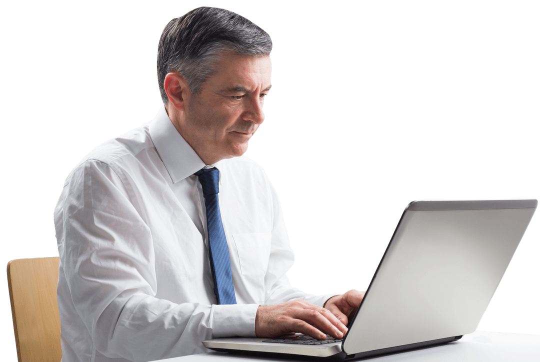 Mature Businessman in Tie Using Laptop with Focused Expression on Face