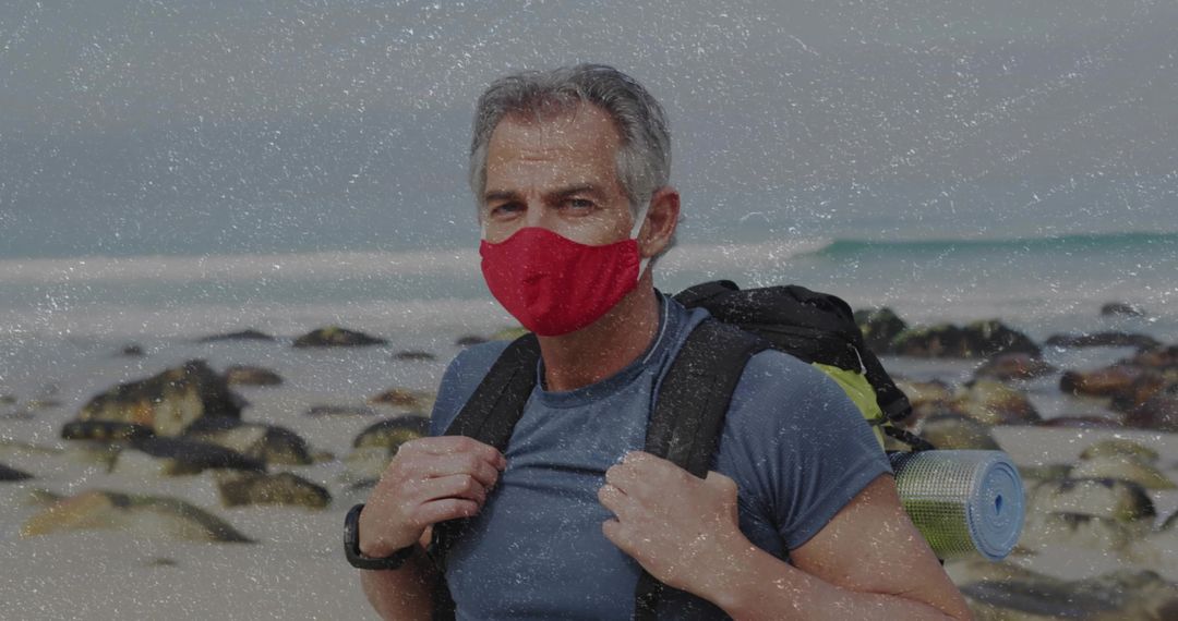 Masked Adventurer Trekking Rocky Beach Coastline