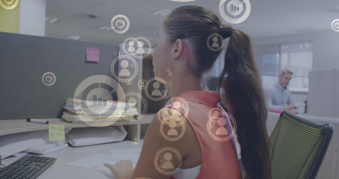 Businesswoman Using Computer with Financial Data Graphics Overlay