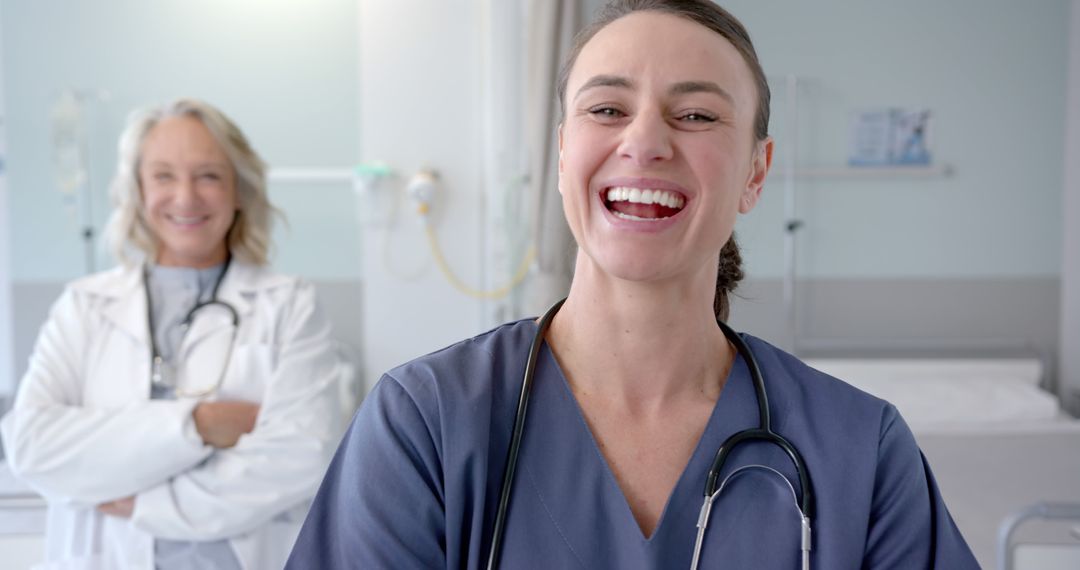 Smiling Doctors in Hospital Setting Showing Confidence and Positivity - Free Images, Stock Photos and Pictures on Pikwizard.com