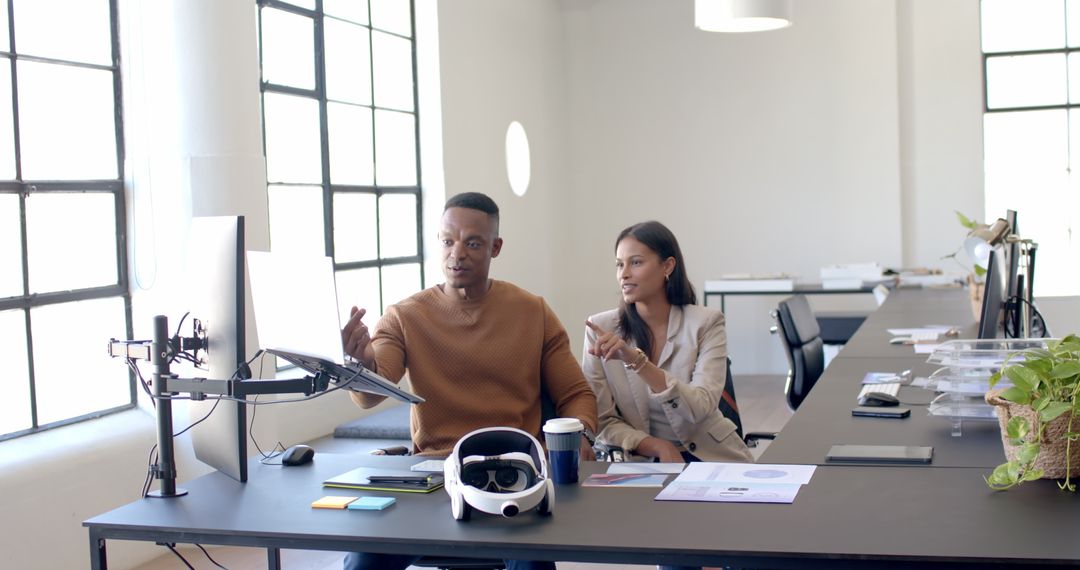 Business Colleagues Collaborating with VR Technology in Office