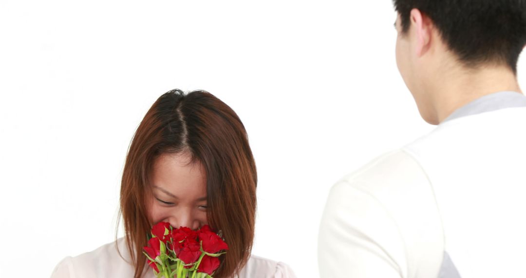 Man Gifting Red Roses to Smiling Woman on White Background - Free Images, Stock Photos and Pictures on Pikwizard.com