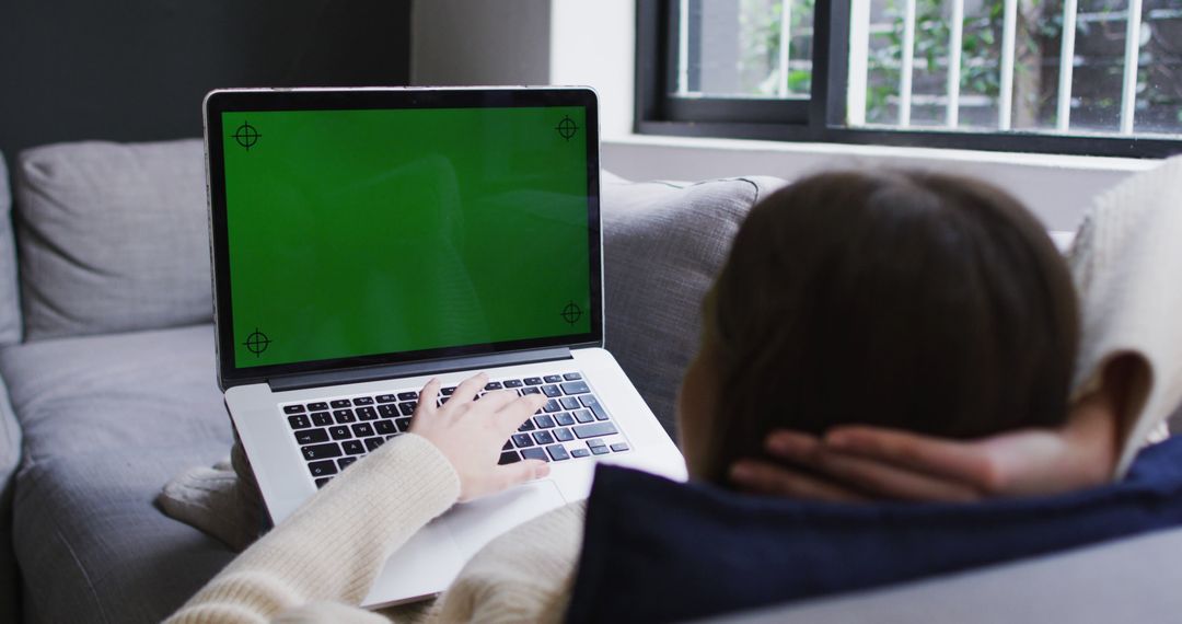 Woman Relaxing on Couch with Laptop Computer Mockup Screen - Free Images, Stock Photos and Pictures on Pikwizard.com