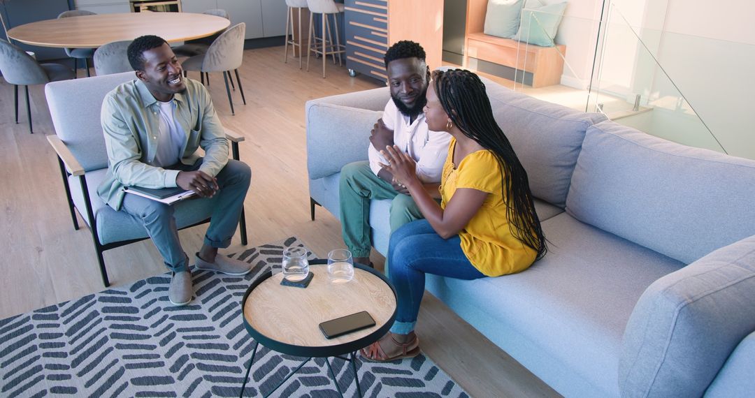 Couple Consulting with Professional Advisor at Home