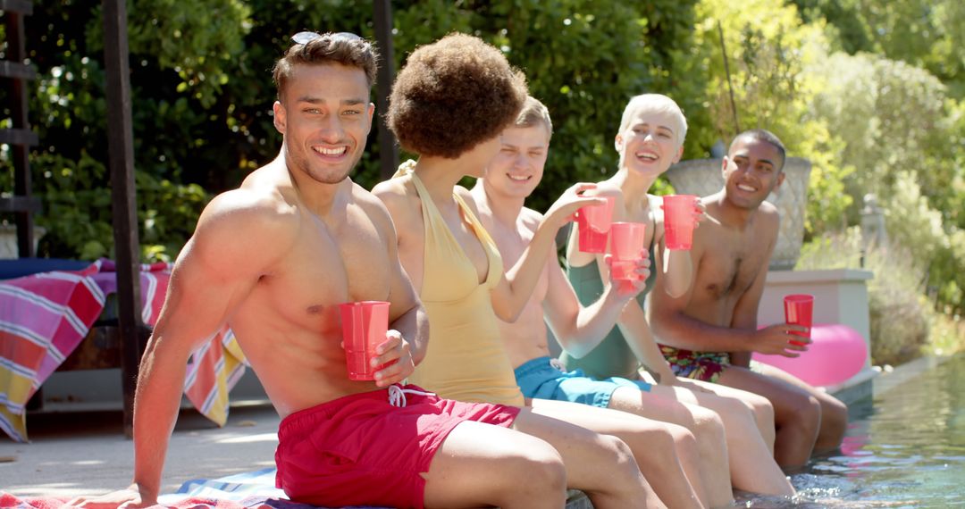 Group of Friends Enjoying Poolside Drinks on a Sunny Day - Free Images, Stock Photos and Pictures on Pikwizard.com