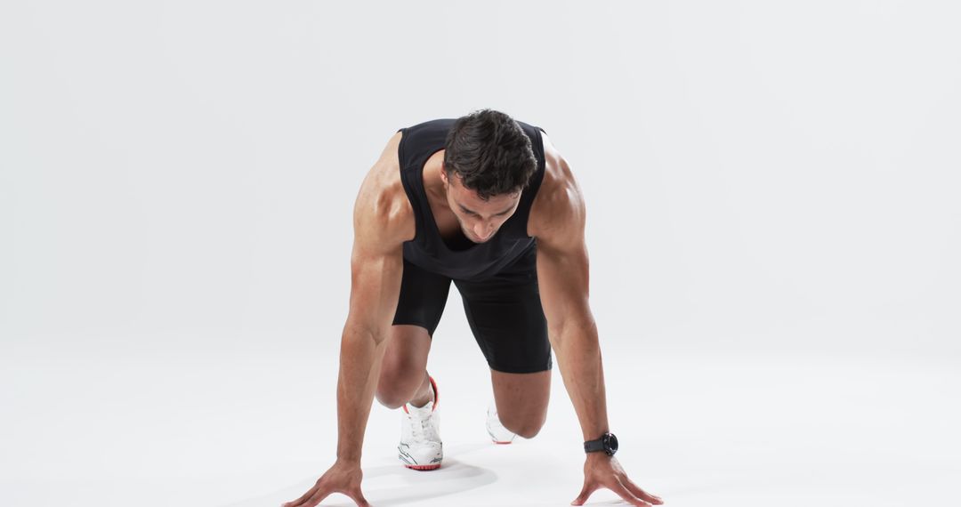 Athlete Preparing at Start Line with Determined Focus