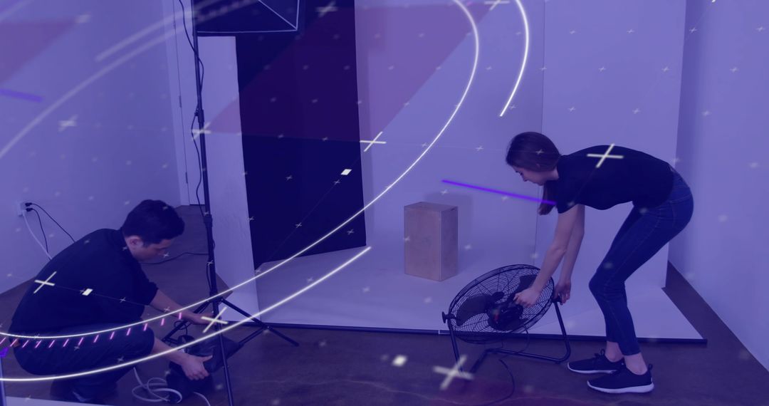 Behind the Scenes: Crew Setting Up Minimalist Photo Shoot Studio