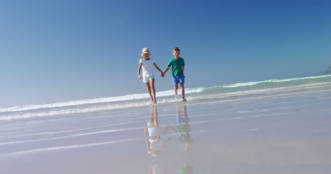 Children Holding Hands Walking on Sunny Beach - Free Images, Stock Photos and Pictures on Pikwizard.com