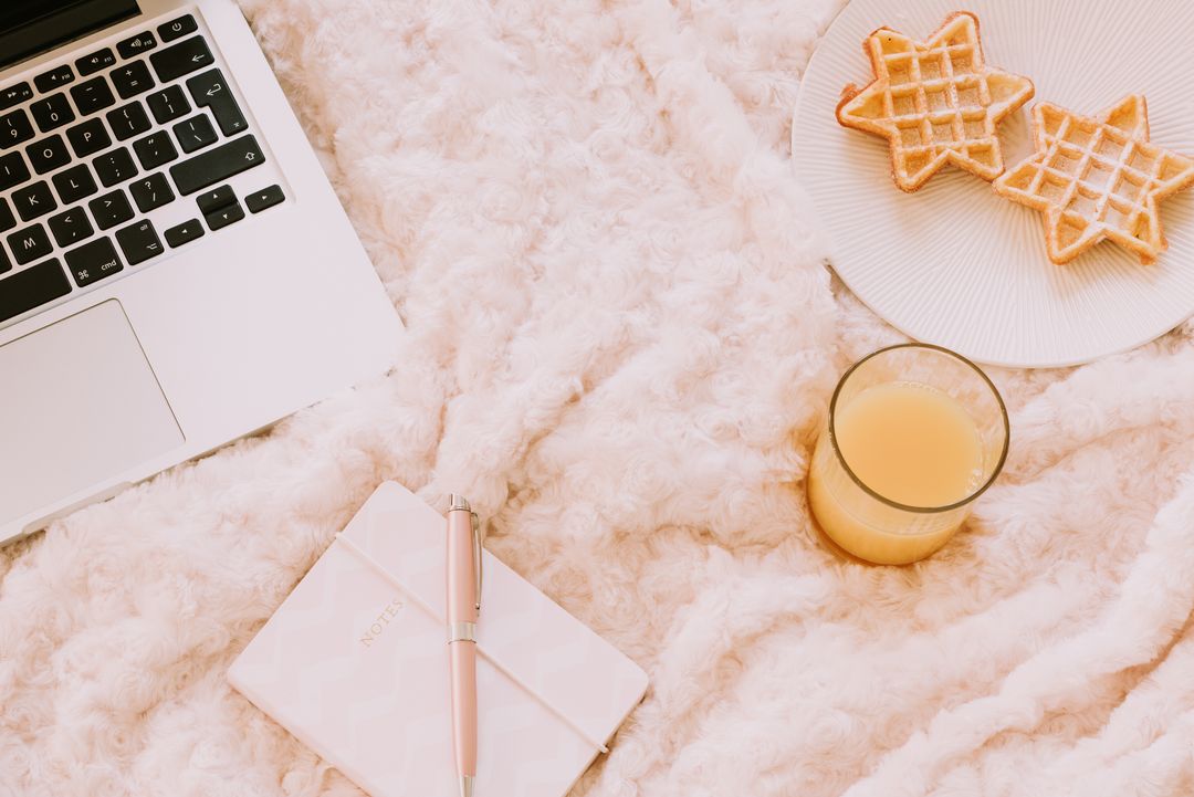 Cozy morning with notebook, waffles, and technology laptop