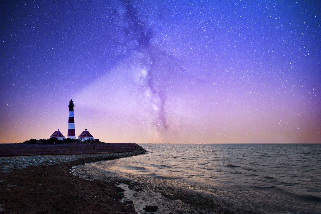 Lighthouse Under Starry Milky Way at Dusk