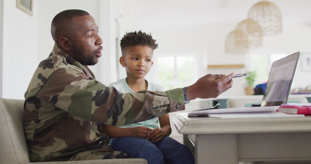 Father in Military Uniform Helping Son with Homework at Home - Free Images, Stock Photos and Pictures on Pikwizard.com