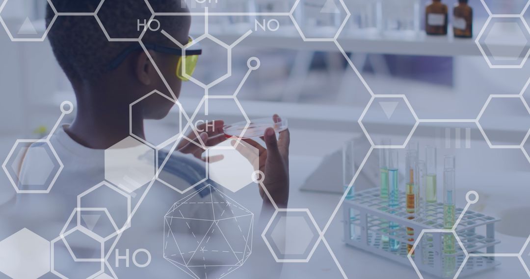 Young Student Examining Petri Dish in Science Lab