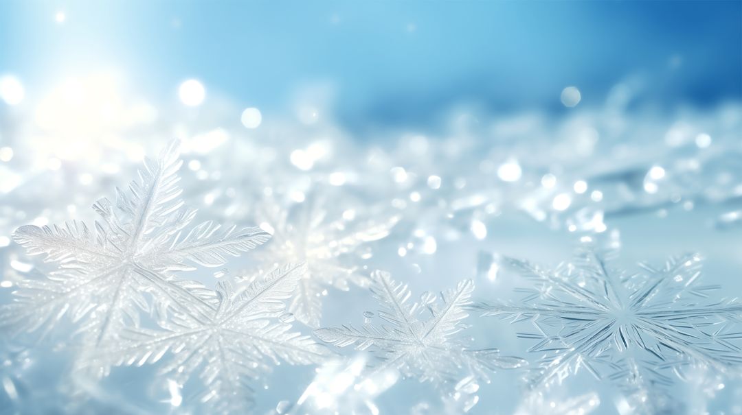 Sparkling macro snowflakes glimmering on soft blue winter bokeh background with icy crystals