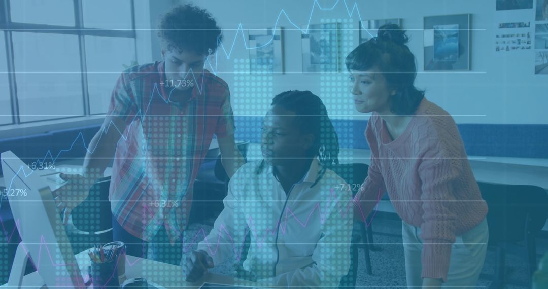 Young Professionals Analyzing Data on Monitor in Modern Workspace