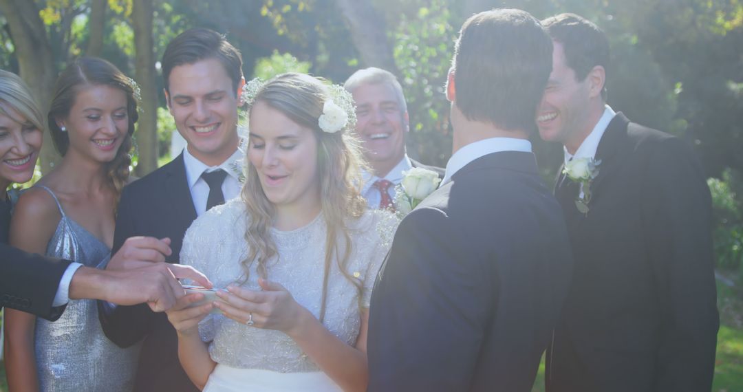Joyful Wedding Ceremony Ring Exchange in Sunlit Garden