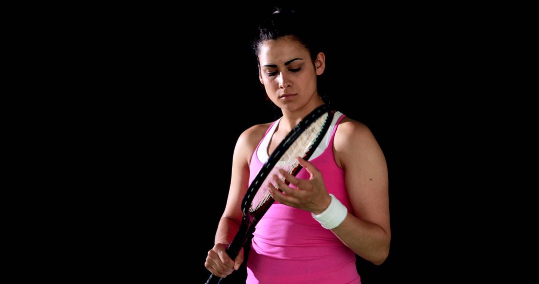 Female Tennis Player Inspecting Racket During Match - Free Images, Stock Photos and Pictures on Pikwizard.com