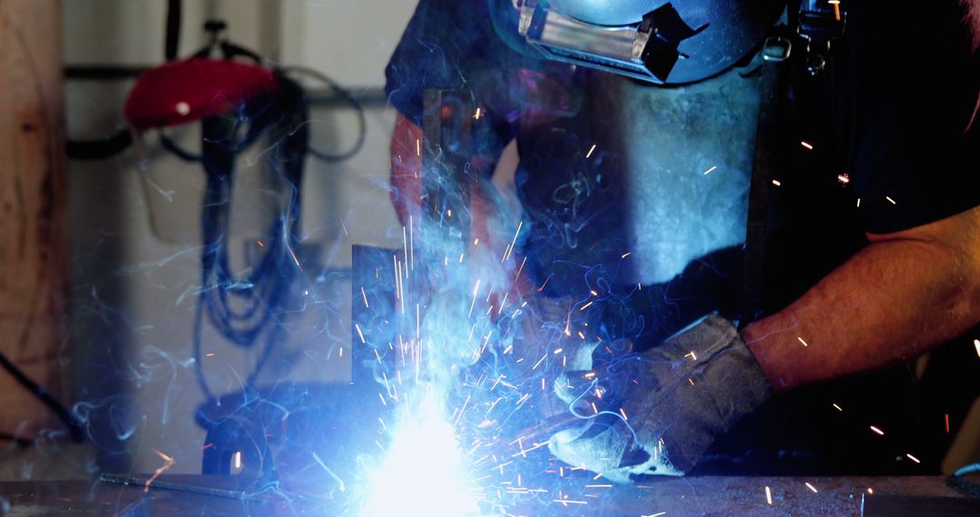 Industrial Welder Using Protective Gear Fabricating Metal in Workshop - Free Images, Stock Photos and Pictures on Pikwizard.com