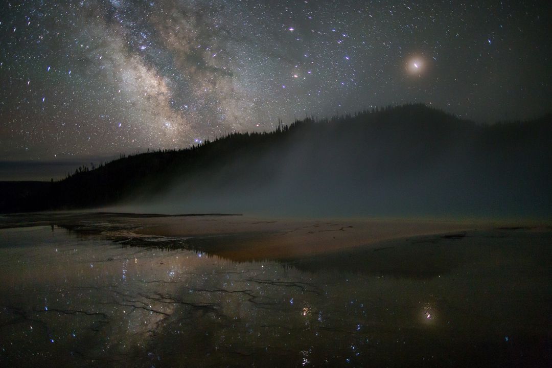 Milky Way Galaxy Reflection over Lake with Misty Mountain in Background - Free Images, Stock Photos and Pictures on Pikwizard.com