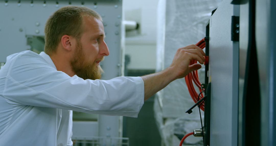 Engineer Working on Electrical Equipment in Laboratory - Free Images, Stock Photos and Pictures on Pikwizard.com