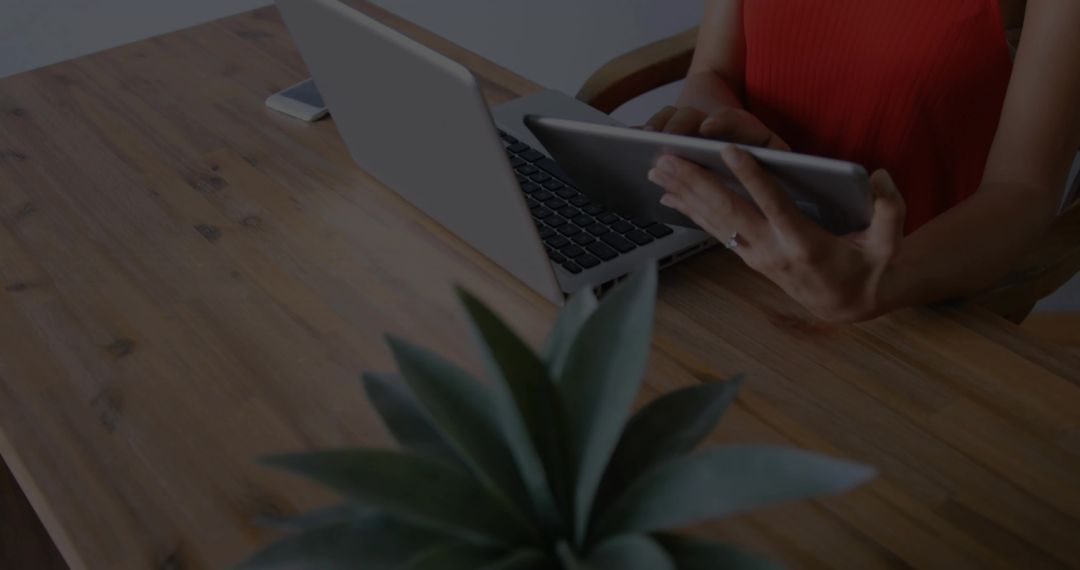 Woman Using Digital Devices at Wooden Desk Modern Minimalist Workspace
