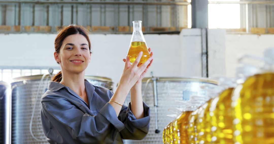 Female Quality Control Worker Analyzing Olive Oil in Factory - Free Images, Stock Photos and Pictures on Pikwizard.com