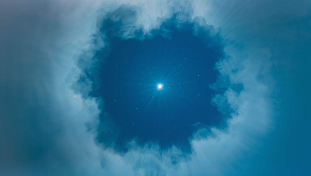 Ethereal Circular Cloud Formation with Radiant Light Center