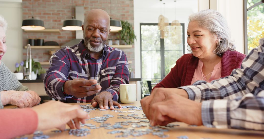 Diverse Group of Seniors Solving Puzzle Together at Home - Free Images, Stock Photos and Pictures on Pikwizard.com