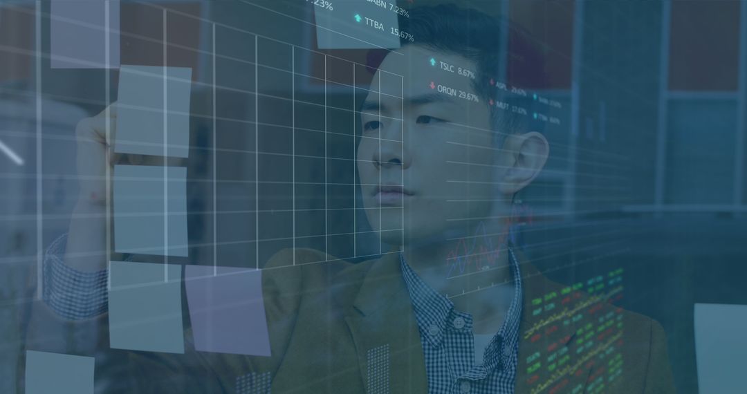 Businessman Analyzing Financial Data on Virtual Interface