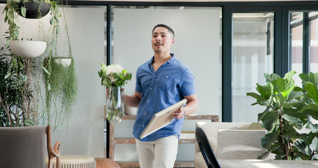 Man Entering Office with Bouquet and Picture Frame