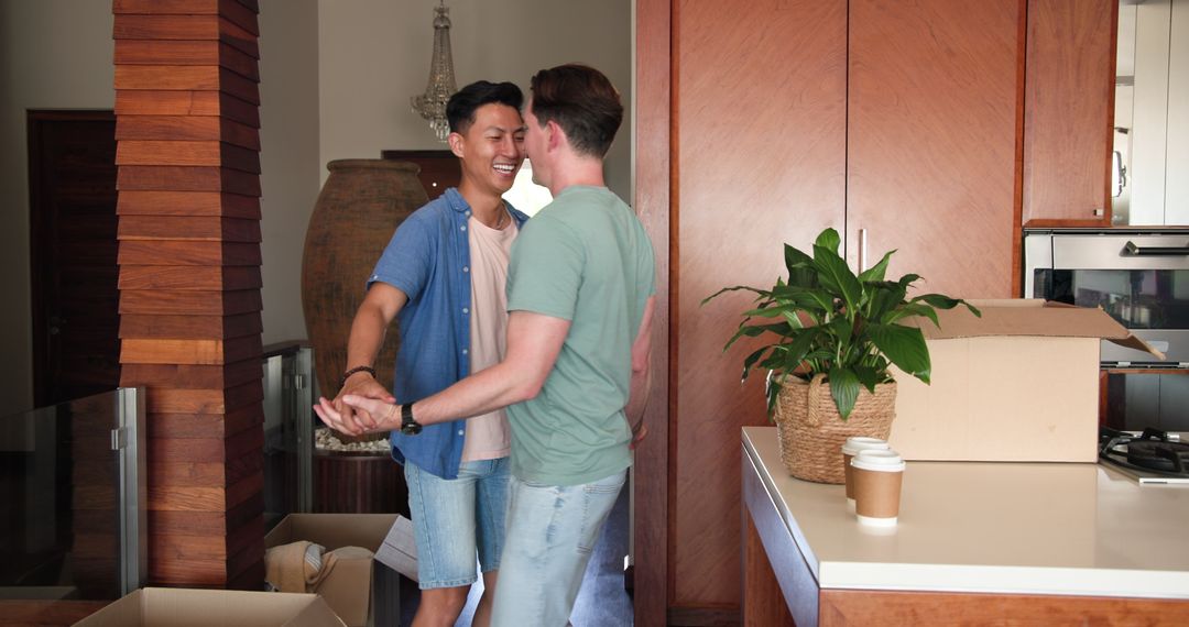 Joyful Couple Dancing in New Home Amid Moving Boxes