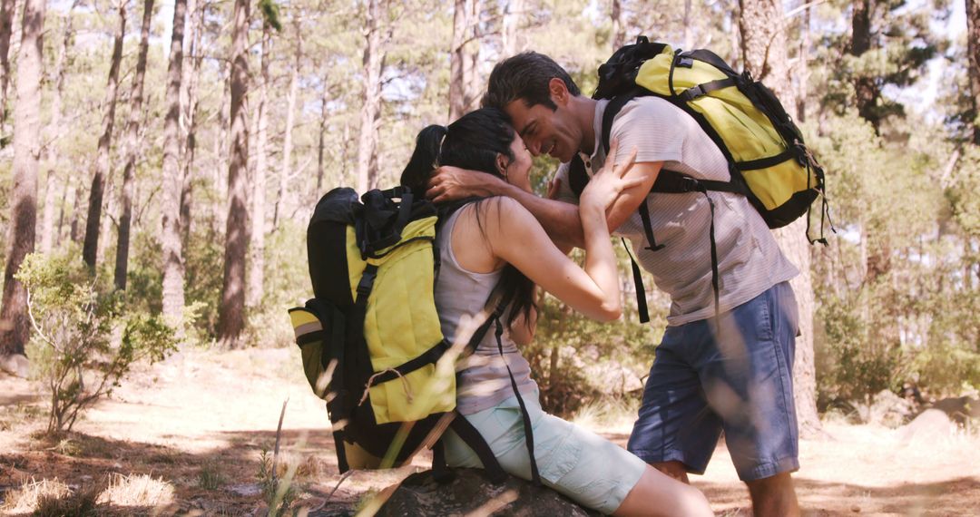 Cheerful couple resting during adventurous forest hike - Free Images, Stock Photos and Pictures on Pikwizard.com