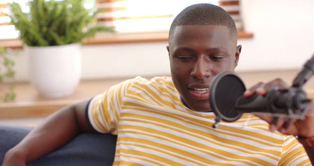 Young Man Podcasting in Minimalist Home Studio