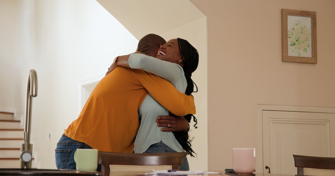 Joyful Mature Couple Embracing in Modern Home