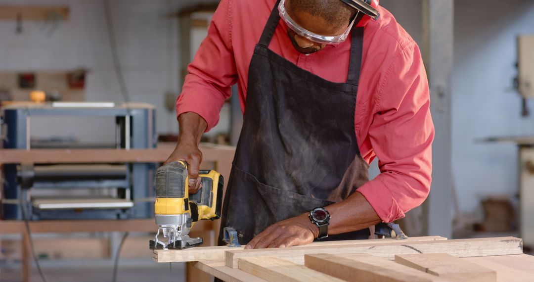 Carpenter Skillfully Shaping Wood with Electric Jigsaw
